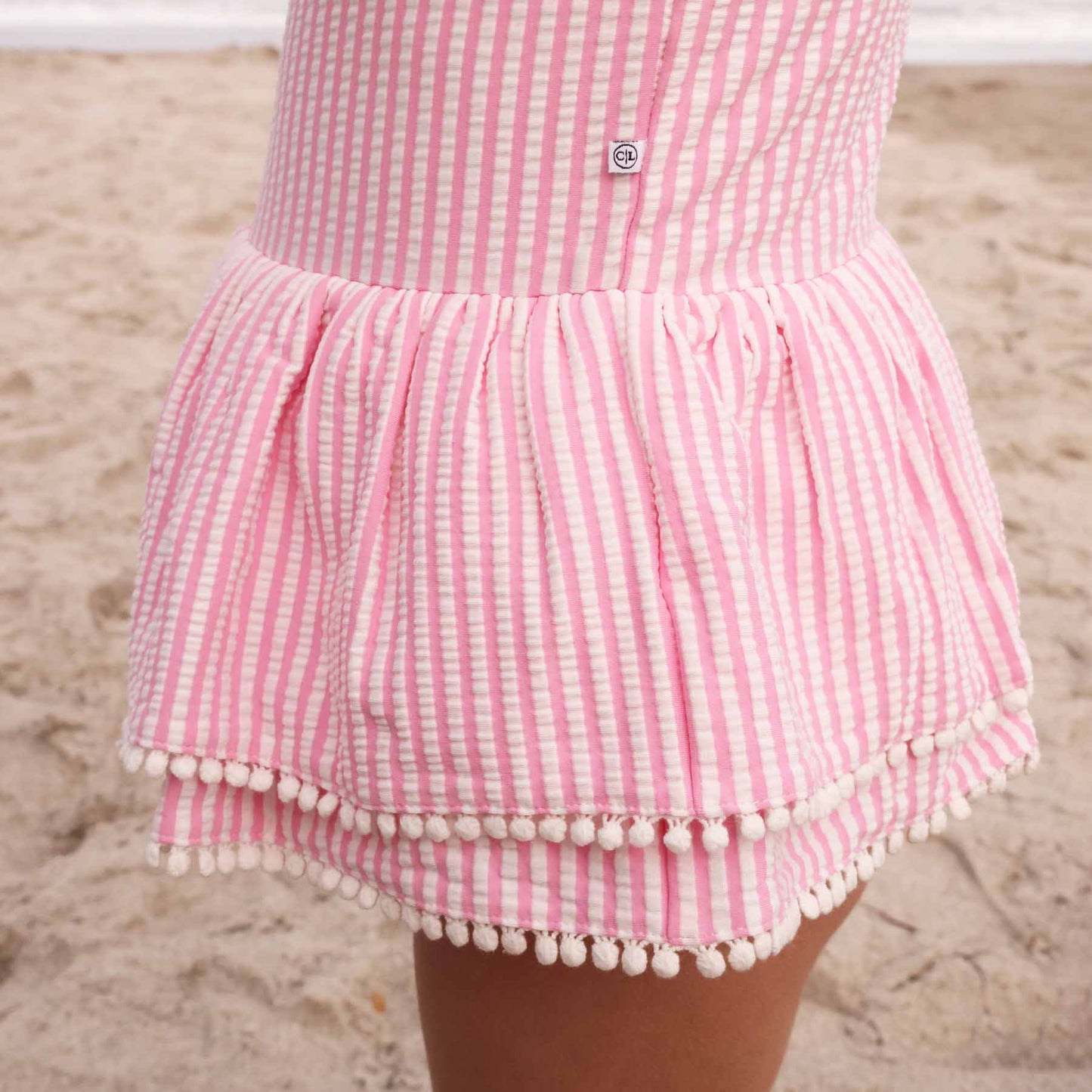 Tiered Skirt with White Pom Trim | Seersucker Dusty Pink Wholesale (2)